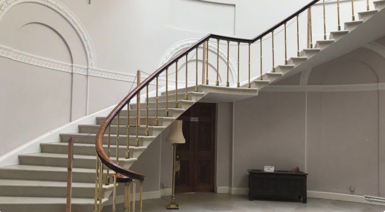 Townley Hall cantilevered staircase in large white hall